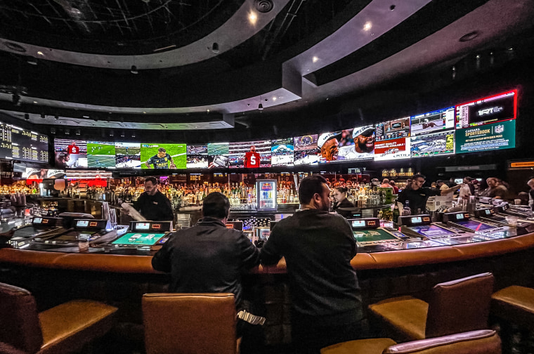 Gamblers at Caesars Sports Book at Caesars Palace Hotel & Casino  